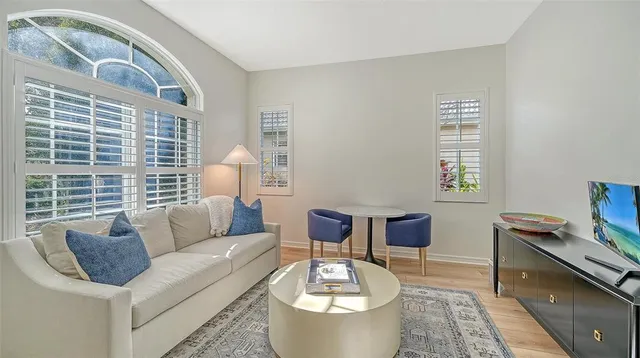 a kitchen with a counter top space a sink and cabinets
