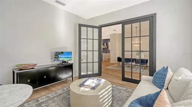 a living room with furniture and a large window