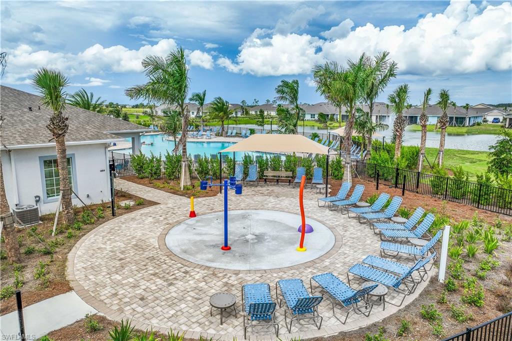 17698 Shade Tree Loop Punta Gorda, FL 33982 - Photo 21 of 28 View of playground featuring a community pool, central AC, a patio, and a water view