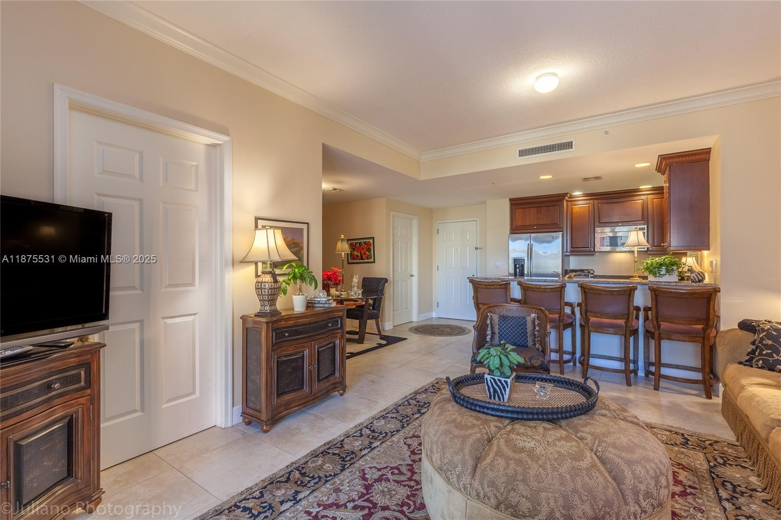 100 Andalusia Avenue, Unit 609 Coral Gables, FL 33134 - Photo 11 of 25 a kitchen with a dining table and chairs