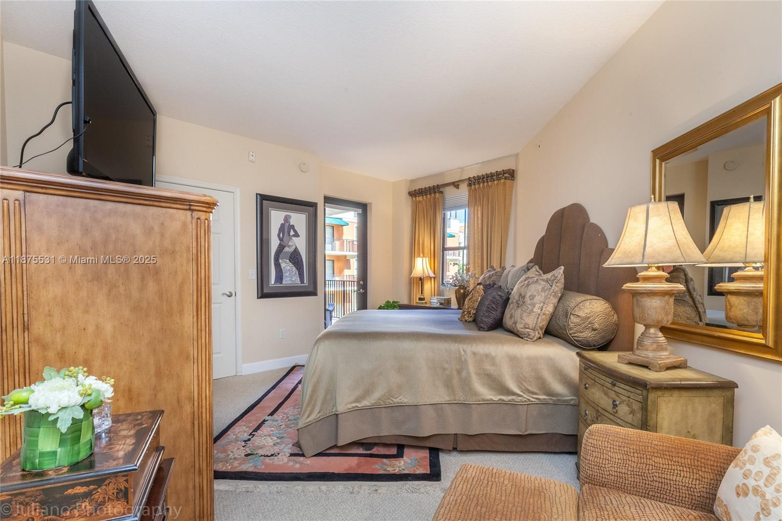 100 Andalusia Avenue, Unit 609 Coral Gables, FL 33134 - Photo 20 of 25 a bedroom with a bed window and couch