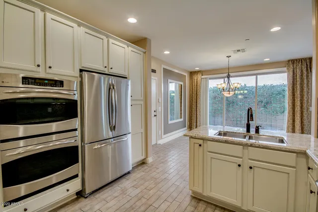 a bathroom with a sink toilet and mirror