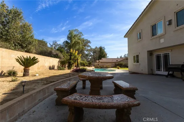 a view of a swimming pool with a lounge chair