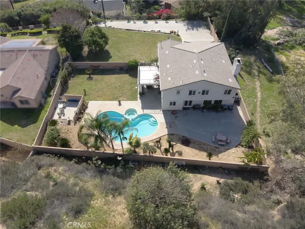 an aerial view of a house with outdoor space