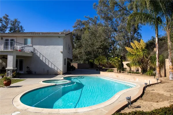a view of a swimming pool with a patio