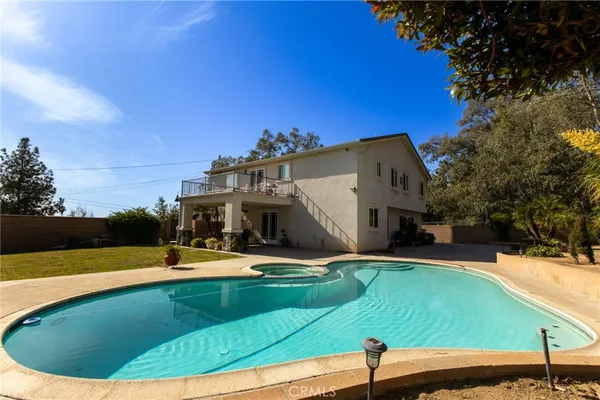 a view of a swimming pool with a patio