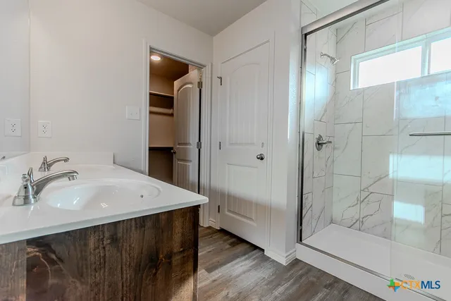 a bathroom with a sink and a mirror