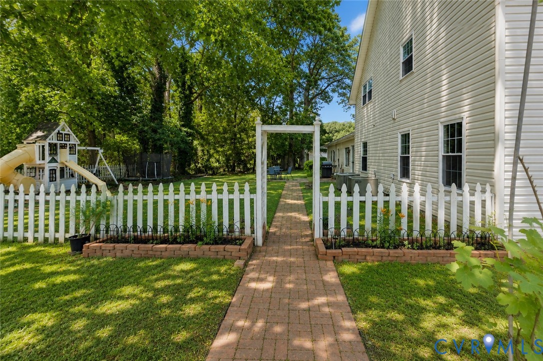 437 Plainview Road Kinsale, VA 22488 - Photo 55 of 63 a front view of a house with a garden