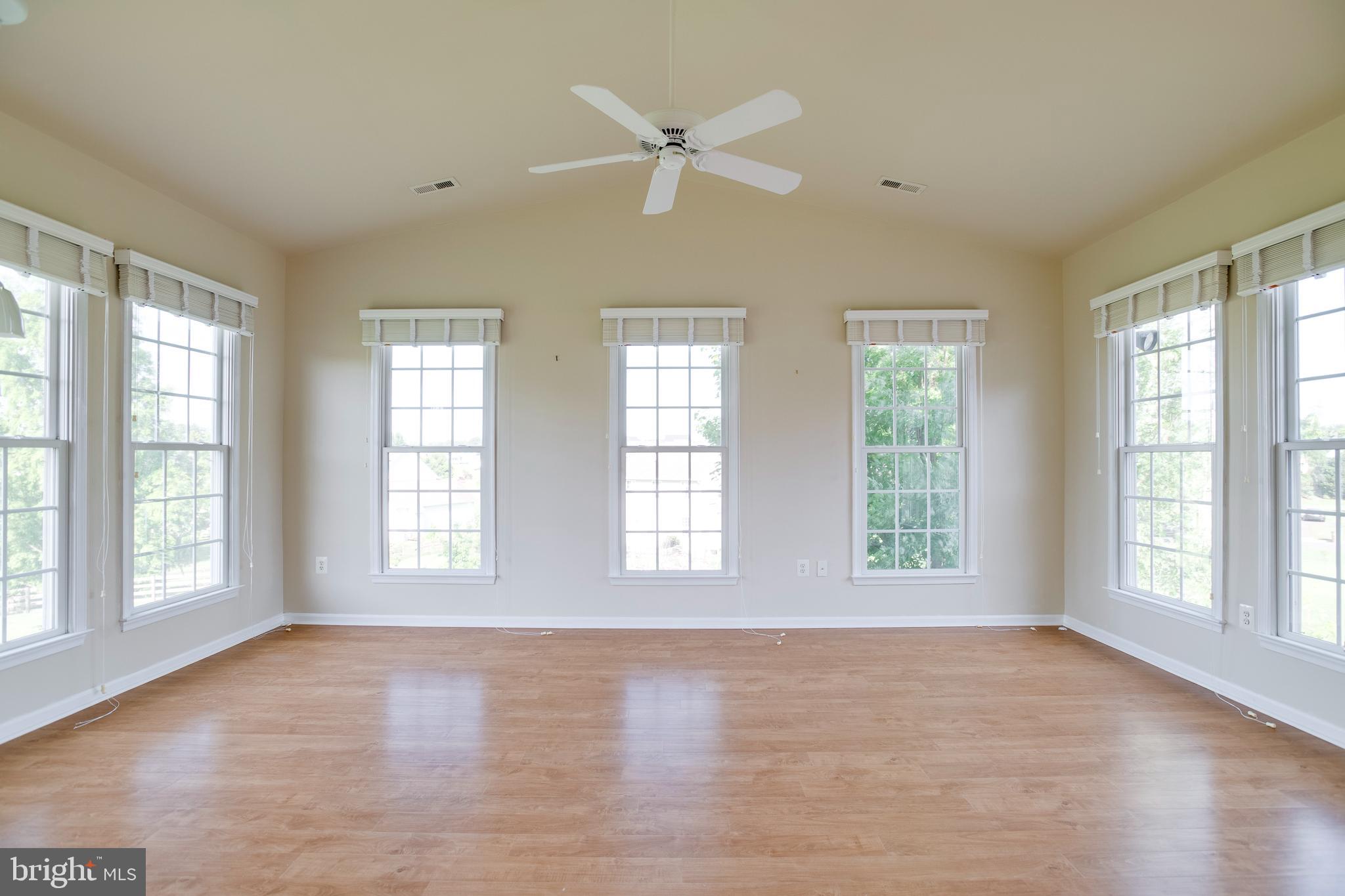 14308 South Hall Court Culpeper, VA 22701 - Photo 19 of 78 a view of an empty room with a window and a kitchen area