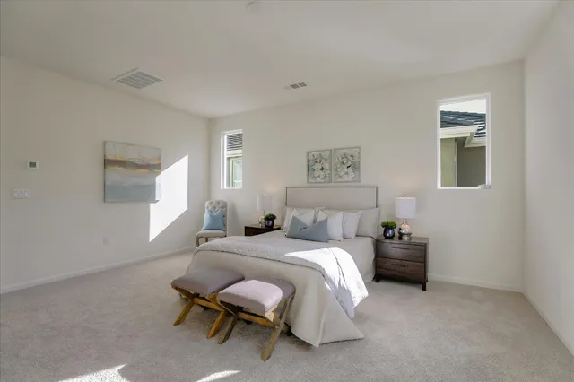 a bedroom with a bed and a cabinets