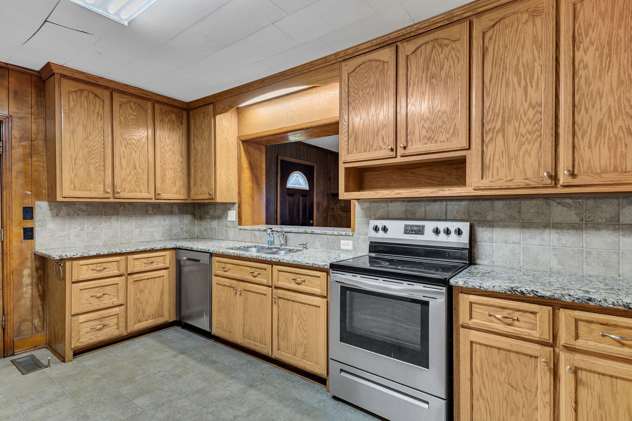 275 Pond Rail Road Dickson, TN 37055 - Photo 12 of 72 a kitchen with granite countertop stainless steel appliances wooden cabinets and a stove top oven