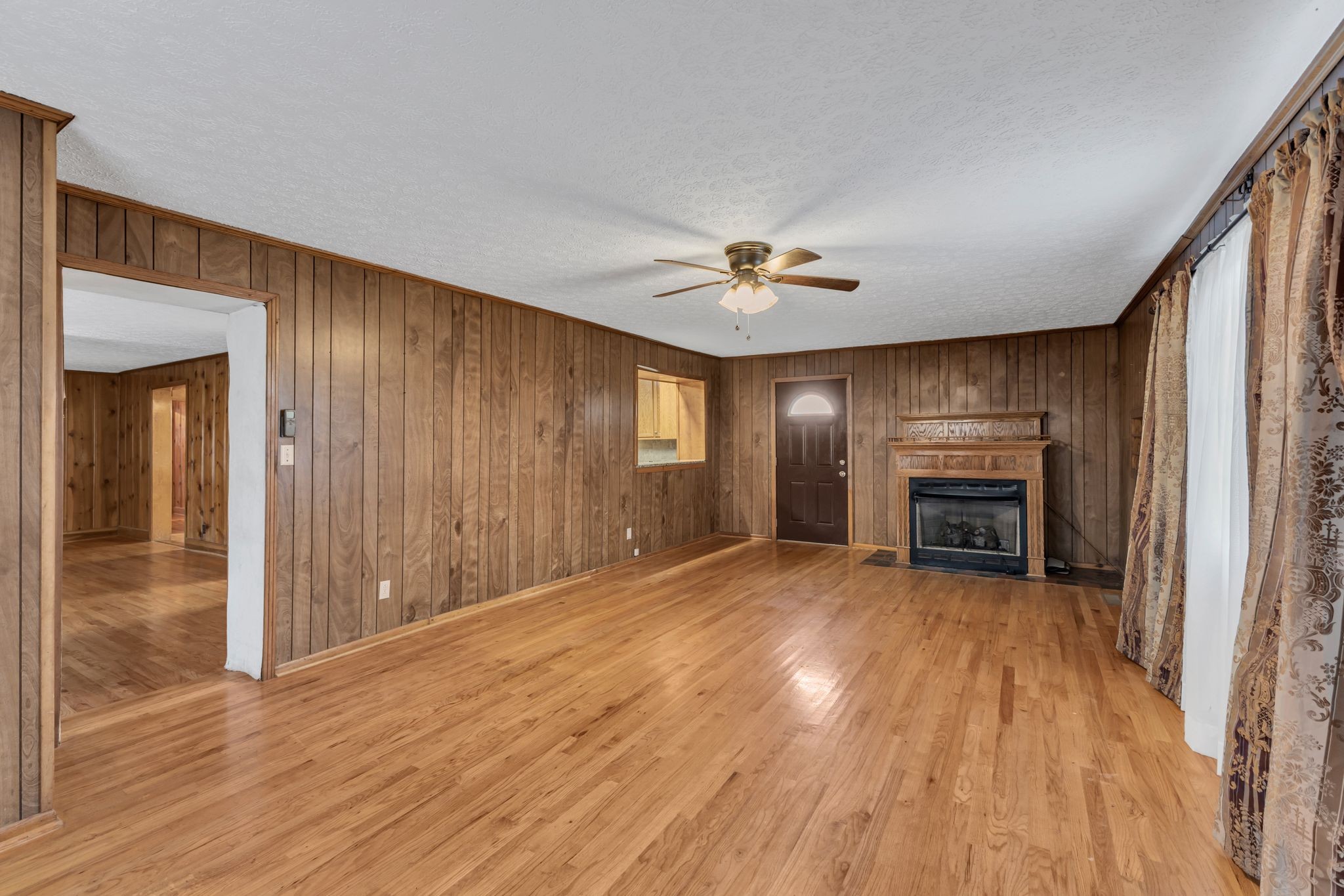 275 Pond Rail Road Dickson, TN 37055 - Photo 14 of 72 a view of an empty room with a window and fireplace