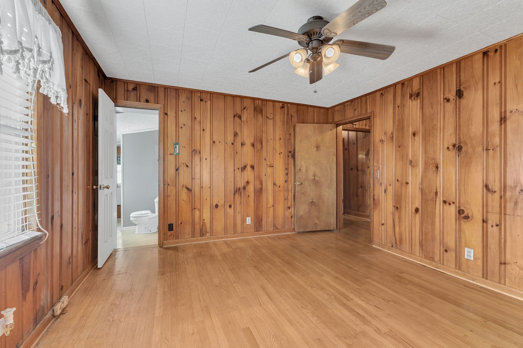275 Pond Rail Road Dickson, TN 37055 - Photo 17 of 72 a view of a room with wooden floor and a ceiling fan