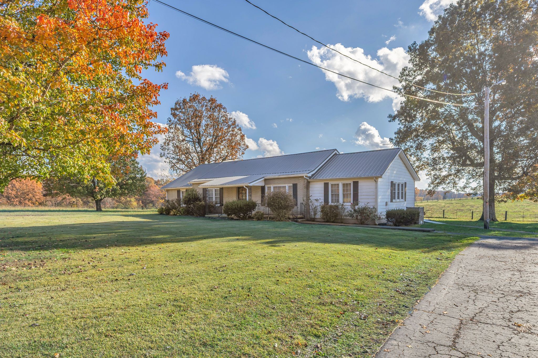 275 Pond Rail Road Dickson, TN 37055 - Photo 4 of 72 a view of a house next to a big yard with large trees