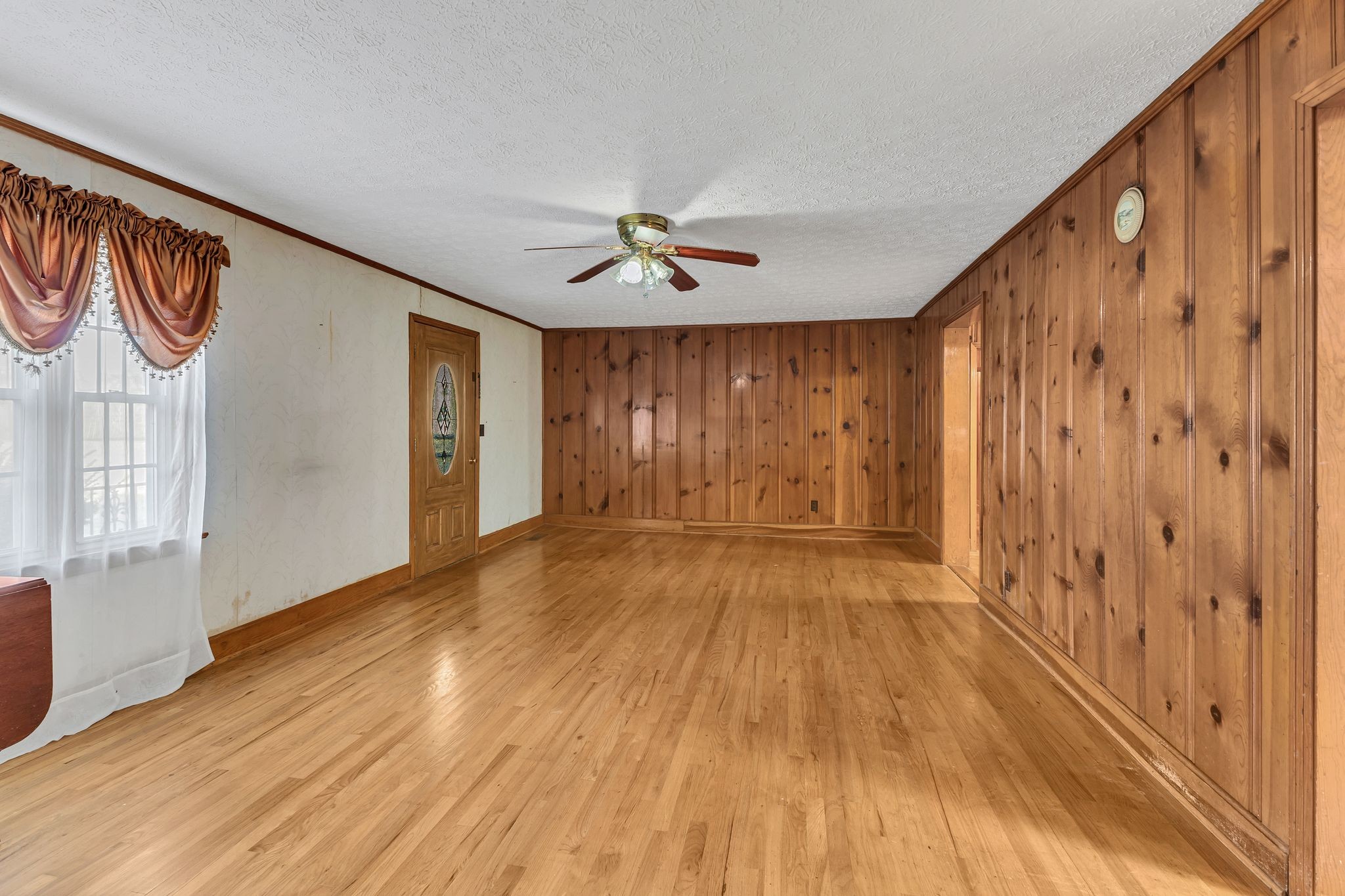 275 Pond Rail Road Dickson, TN 37055 - Photo 7 of 72 a view of an empty room with a window and wooden floor
