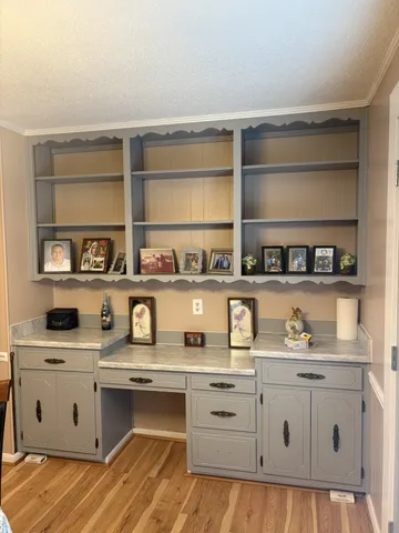 a view of cabinets a window and a couch