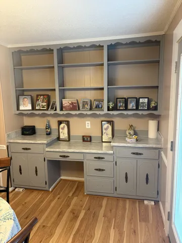 a kitchen with stainless steel appliances a stove and cabinets