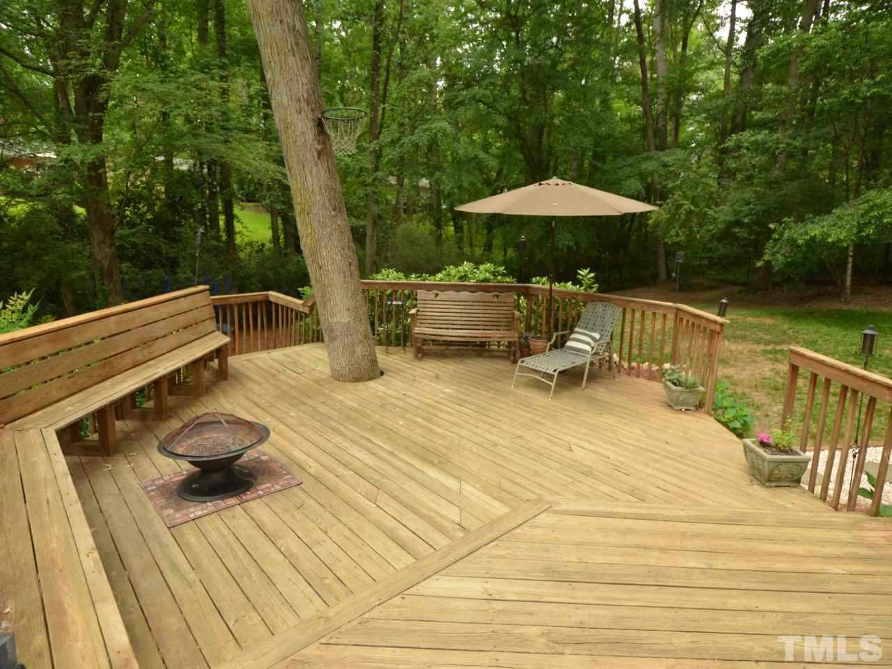 1228 Kingston Ridge Road Cary, NC 27511 - Photo 17 of 19 a backyard of a house with table and chairs