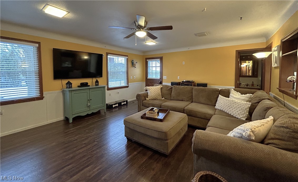 1748 Sunview Road Lyndhurst, OH 44124 - Photo 2 of 41 Family Room with laminate flooring and chair railing with wainscotting.