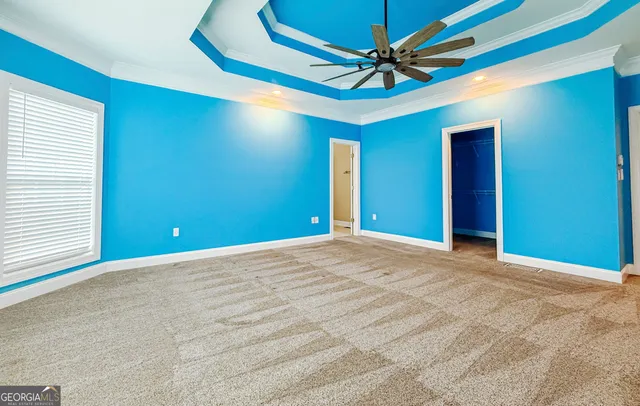 a spacious bathroom with a double vanity sink and a mirror