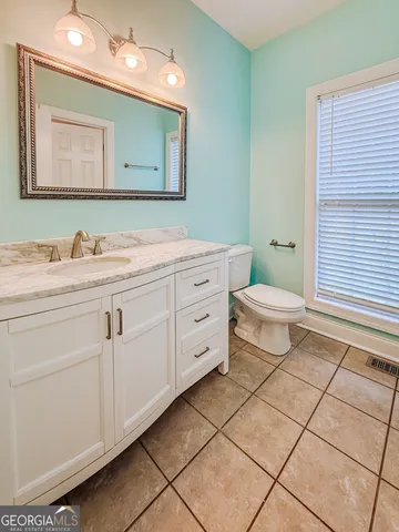 a bathroom with a bathtub and a toilet