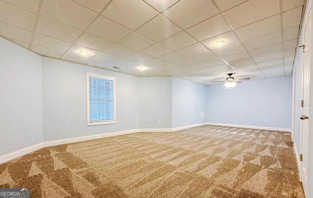a view of a living room with a black and white wooden floor