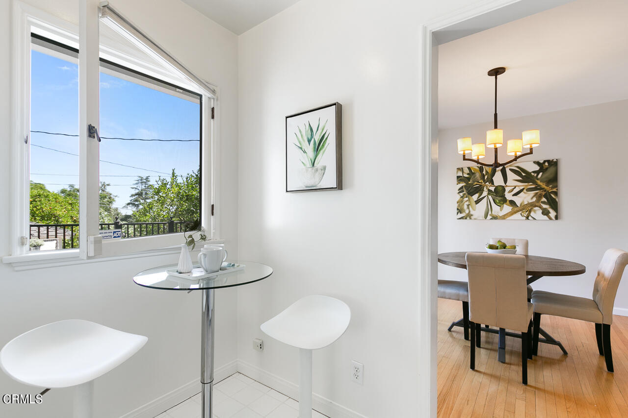 982 Athens Street Altadena, CA 91001 - Photo 11 of 25 a view of a dining room with furniture window and wooden floor