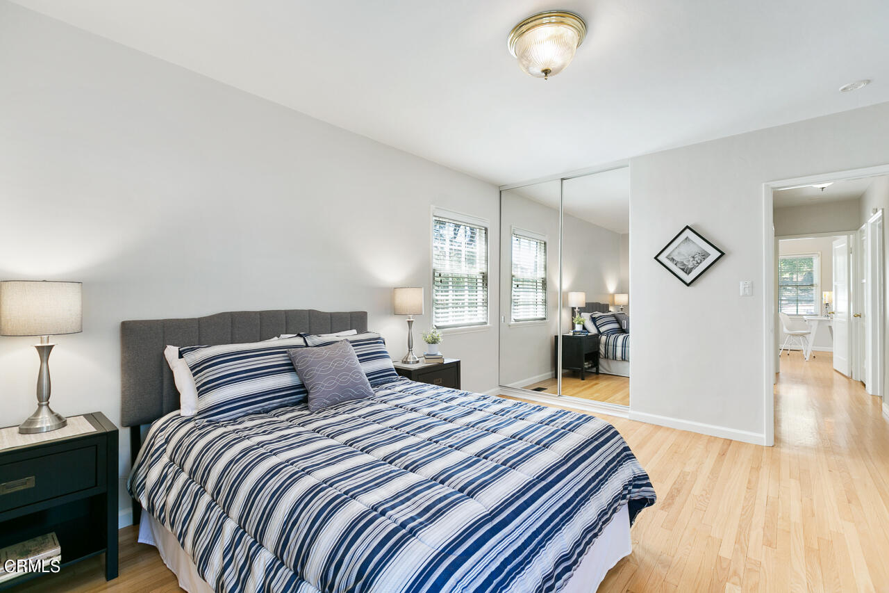 982 Athens Street Altadena, CA 91001 - Photo 14 of 25 a bedroom with bed and wooden floor