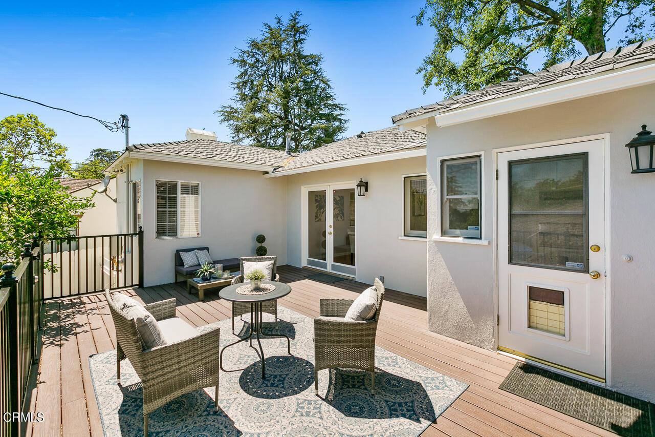982 Athens Street Altadena, CA 91001 - Photo 18 of 25 a view of a patio with couches chairs and potted plants