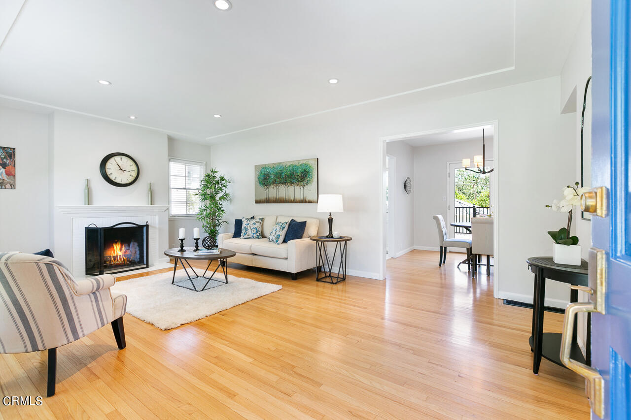 982 Athens Street Altadena, CA 91001 - Photo 2 of 25 a living room with furniture and a fireplace