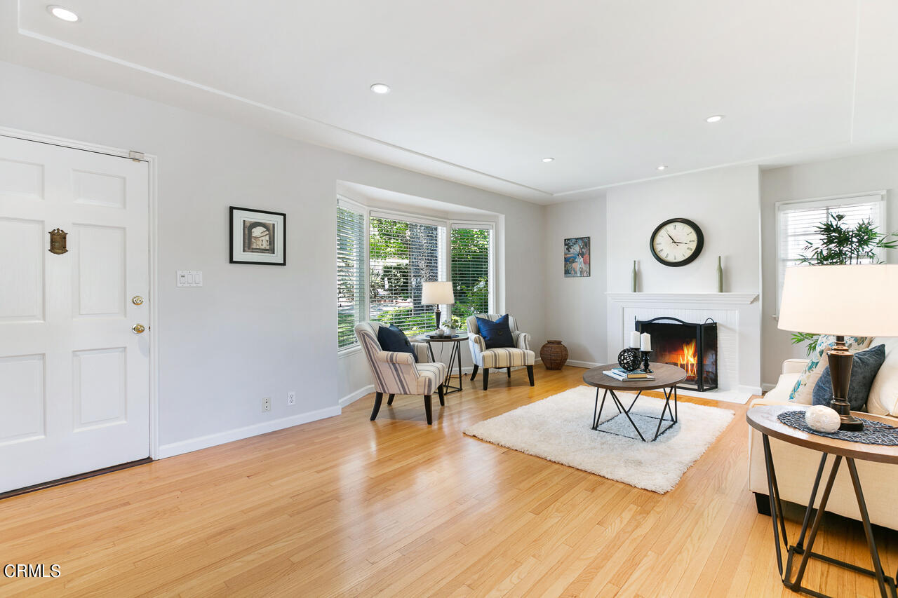 982 Athens Street Altadena, CA 91001 - Photo 4 of 25 a living room with furniture a fireplace and window