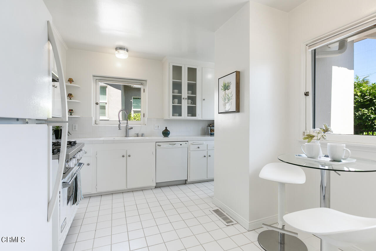 982 Athens Street Altadena, CA 91001 - Photo 7 of 25 a kitchen with cabinets and sink