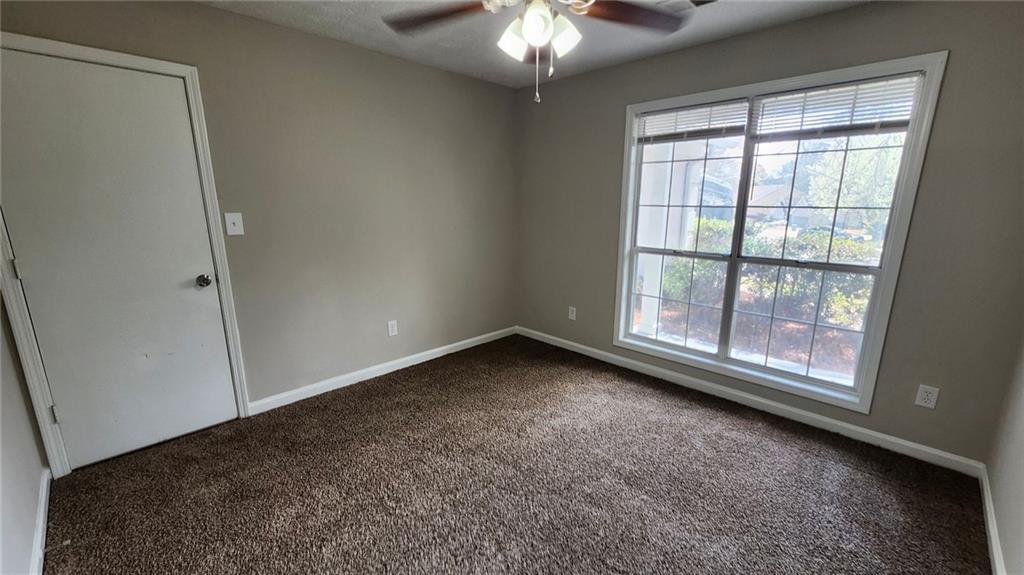 587 North Shore Road Lithonia, GA 30058 - Photo 13 of 16 an empty room with a window