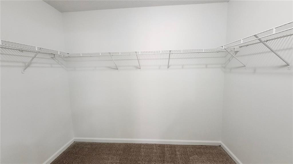 587 North Shore Road Lithonia, GA 30058 - Photo 9 of 16 a view of a room with racks on the wall
