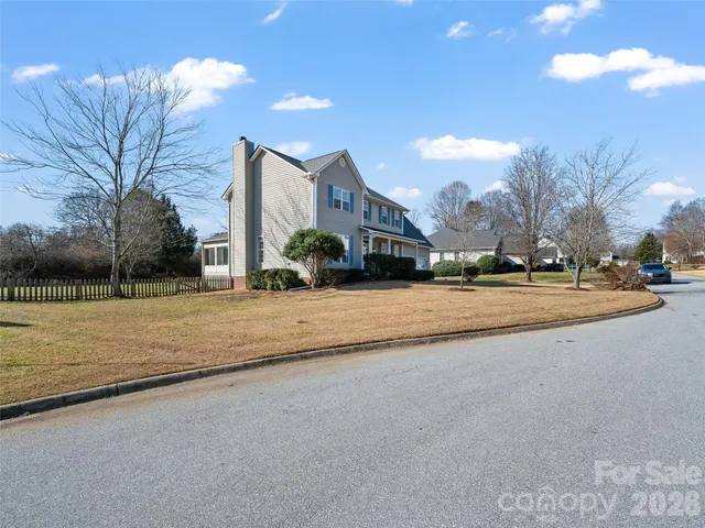 a view of road with building and trees