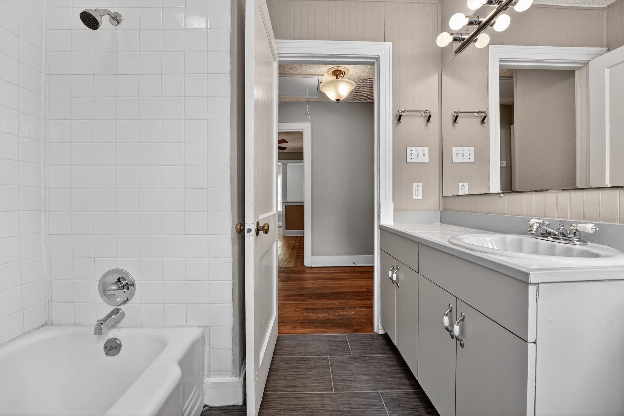 4907 Duval Street Austin, TX 78751 - Photo 20 of 31 a bathroom with a sink and a bathtub