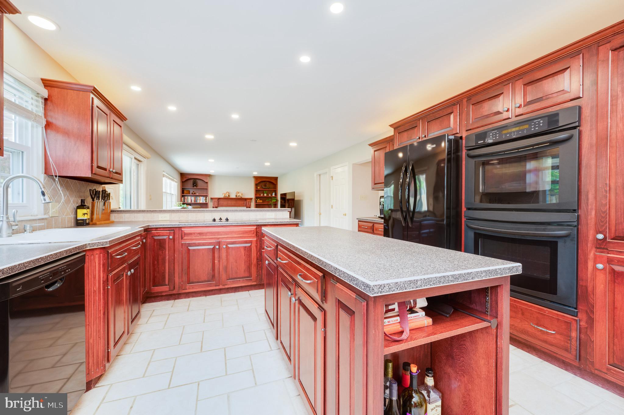 1 Flint Ridge Drive Reading, PA 19607 - Photo 6 of 49 a large kitchen with stainless steel appliances granite countertop a large stove a sink and a microwave