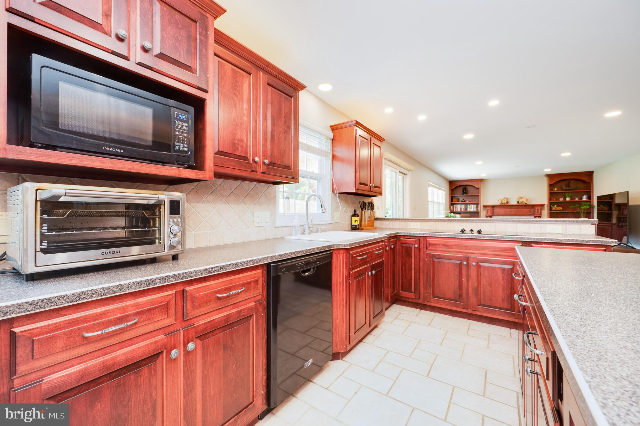 1 Flint Ridge Drive Reading, PA 19607 - Photo 7 of 49 a kitchen with stainless steel appliances granite countertop a stove top oven a sink dishwasher and a microwave oven on the blue kitchen countertops