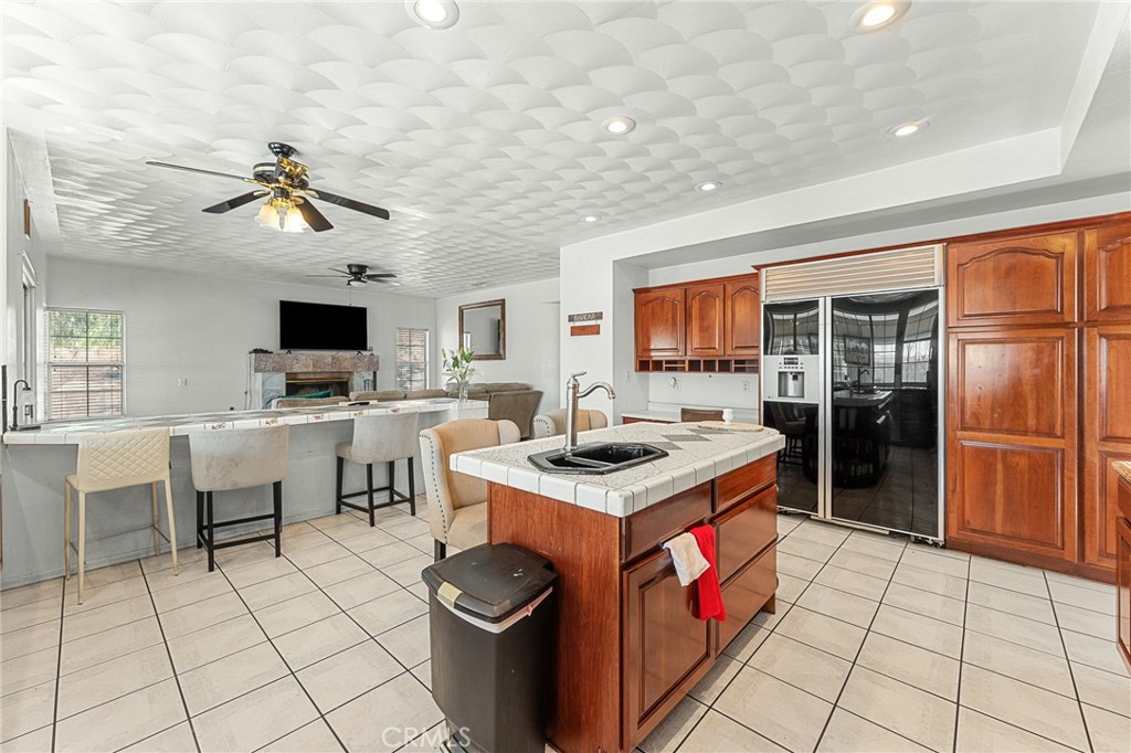 17234 Gamble Avenue Riverside, CA 92504 - Photo 14 of 56 a kitchen that has a stove a sink and a microwave