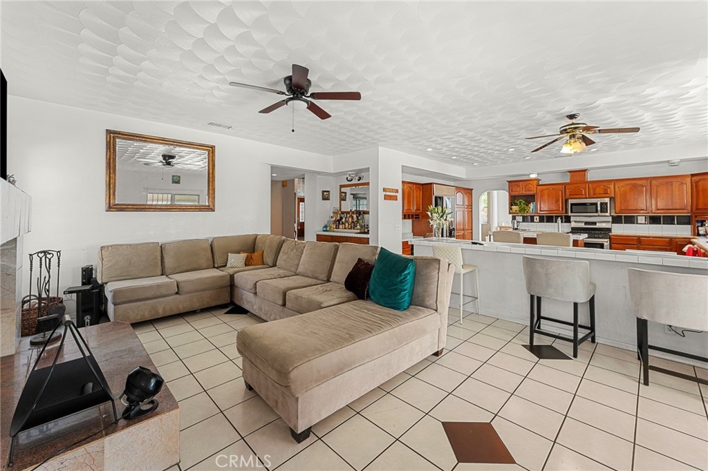 17234 Gamble Avenue Riverside, CA 92504 - Photo 17 of 56 a living room with furniture and a view of kitchen