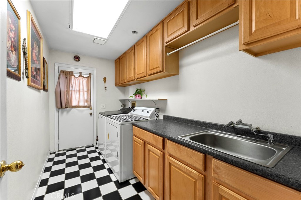 17234 Gamble Avenue Riverside, CA 92504 - Photo 21 of 56 a kitchen with stainless steel appliances granite countertop a sink stove and refrigerator