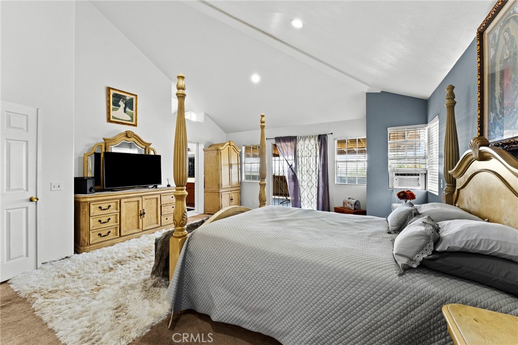 17234 Gamble Avenue Riverside, CA 92504 - Photo 28 of 56 a bedroom with a bed and a flat screen tv