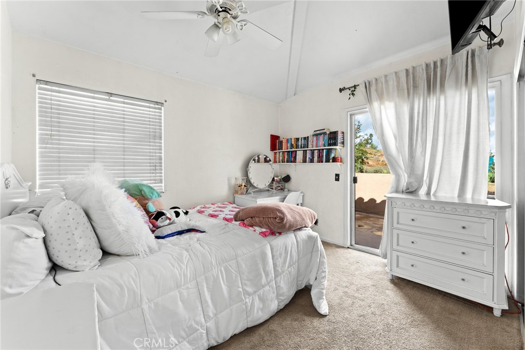 17234 Gamble Avenue Riverside, CA 92504 - Photo 36 of 56 a bedroom with a bed and a window