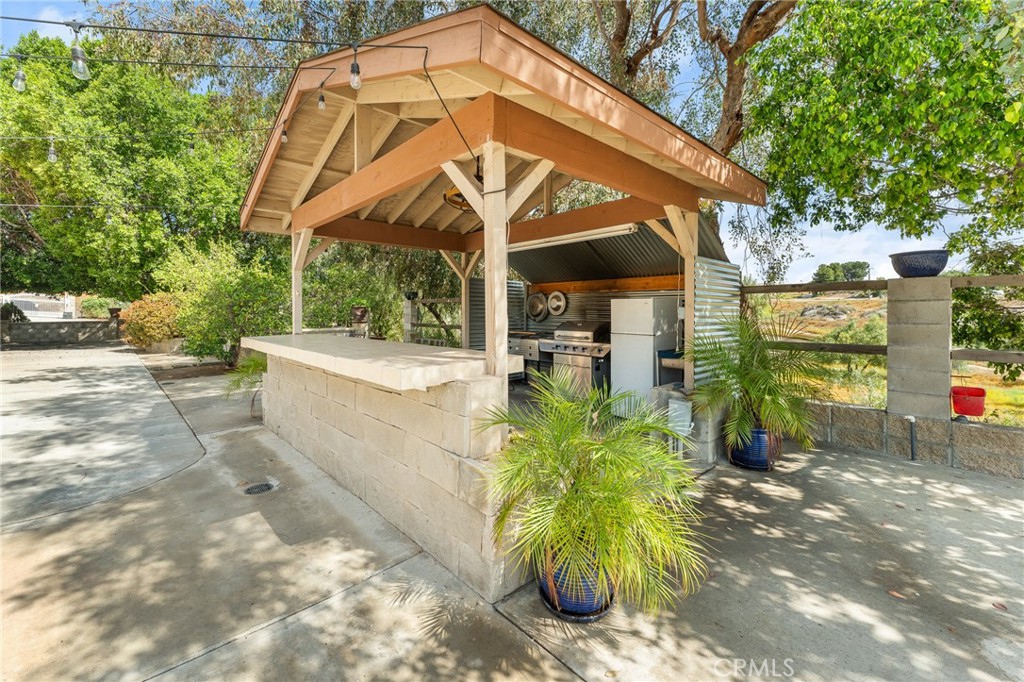 17234 Gamble Avenue Riverside, CA 92504 - Photo 46 of 56 a view of a white house with a yard