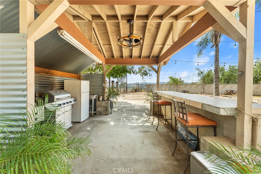 17234 Gamble Avenue Riverside, CA 92504 - Photo 48 of 56 a view of a chairs and table in the patio