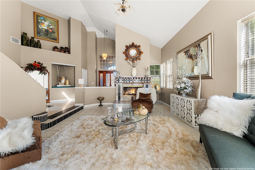 17234 Gamble Avenue Riverside, CA 92504 - Photo 6 of 56 a living room with furniture and a fireplace