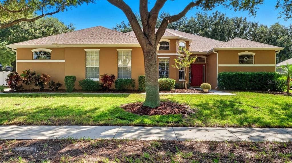2360 Home Again Road Apopka, FL 32712 - Photo 1 of 1 a front view of a house with garden