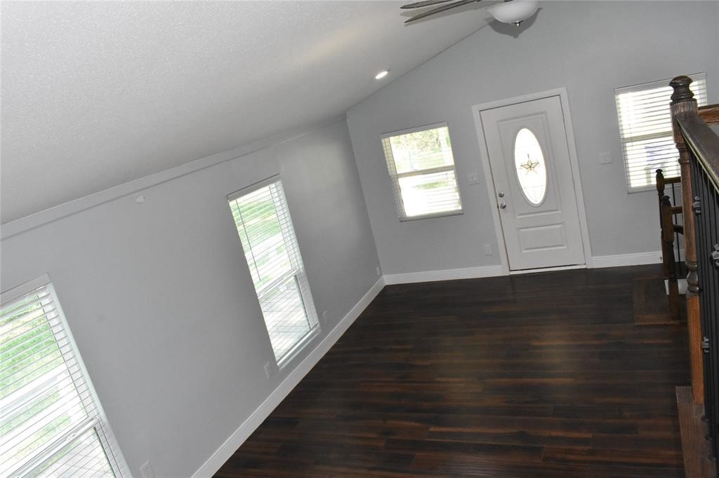 15 Walnut Lane Point Blank, TX 77364 - Photo 11 of 31 a view of empty room with wooden floor and fan