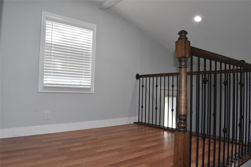 15 Walnut Lane Point Blank, TX 77364 - Photo 13 of 31 a view of a hallway with wooden floor and a window