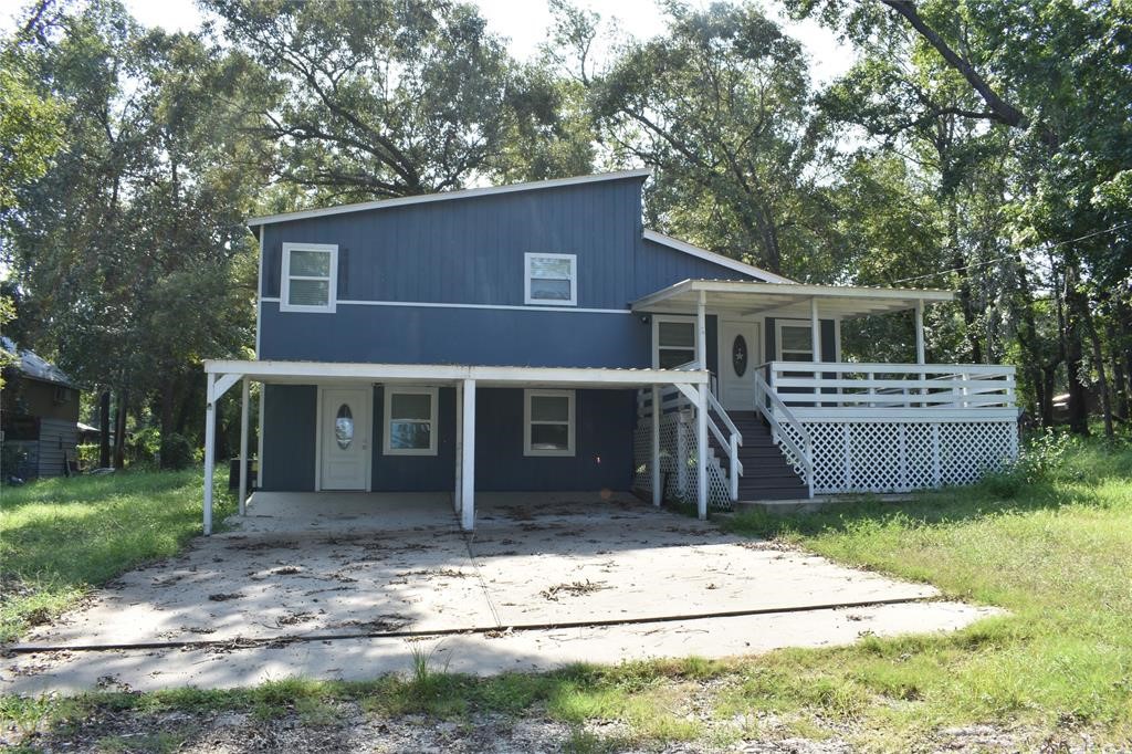 15 Walnut Lane Point Blank, TX 77364 - Photo 2 of 31 a view of a house with a yard